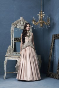 Peplum Top In Textured Silk Worn Over Plain Duchess Skirt By Designer Rashi Kapoor